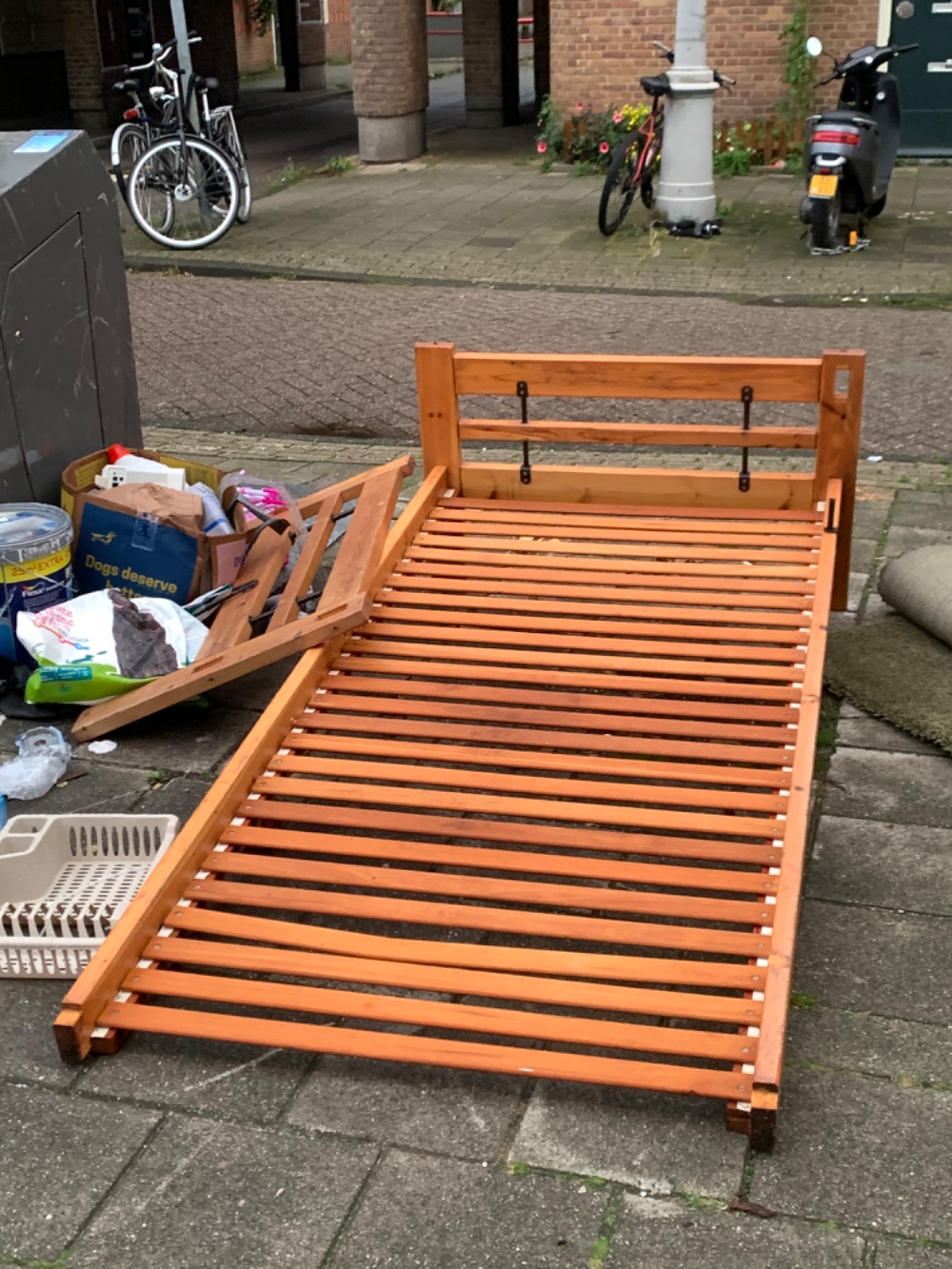 A wooden bed frame. A bit soaked but because it is a real wood it might be ok?