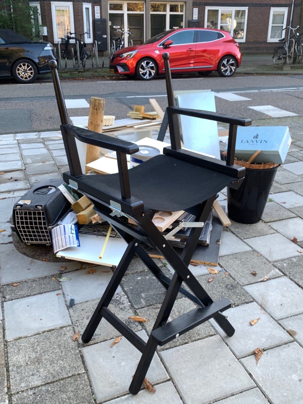 Some kind of folding chair. Like a director chair, but lacking the back piece? 