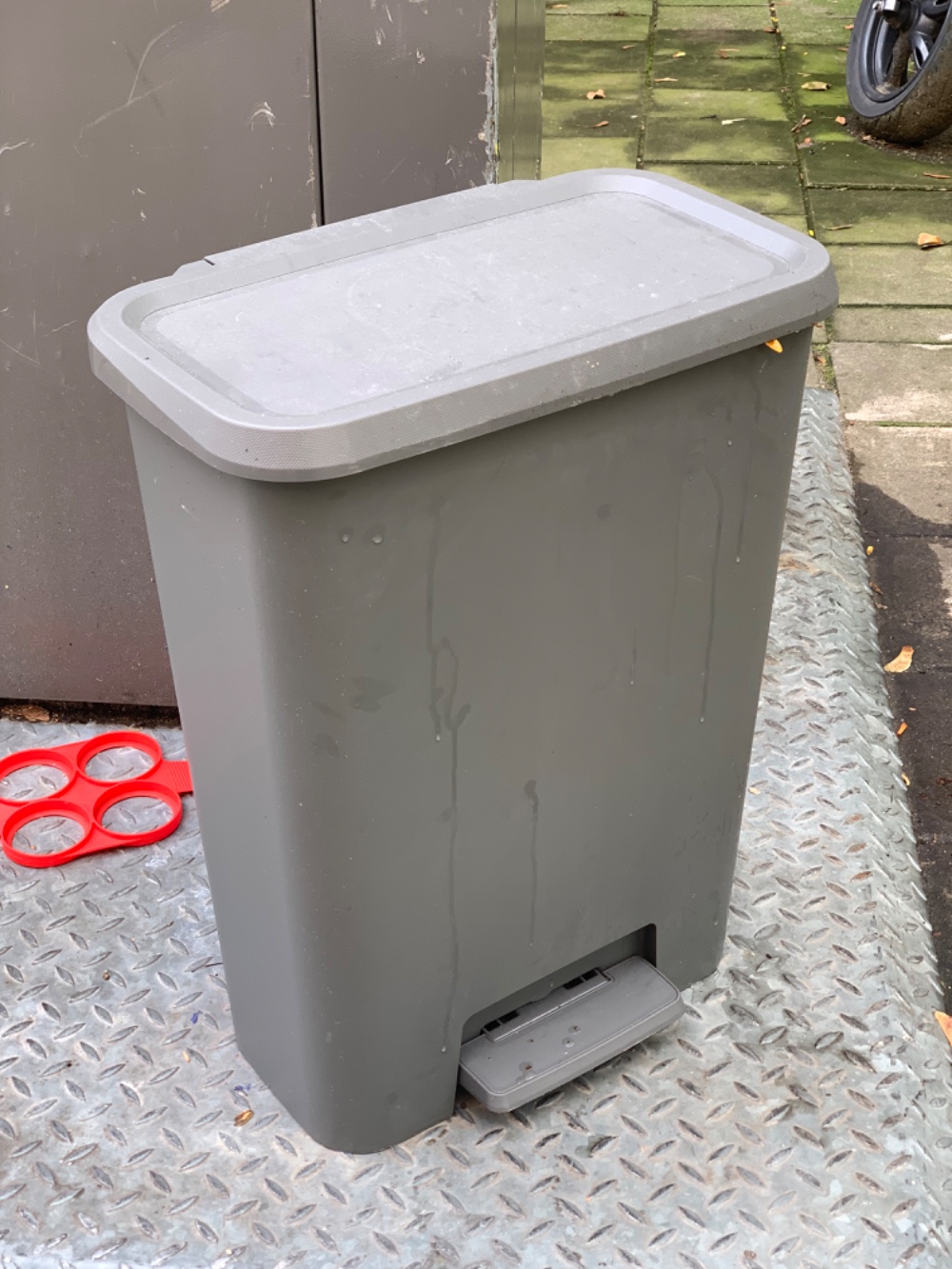 A garbage bin with a lid. A bit dirty inside but nothing major