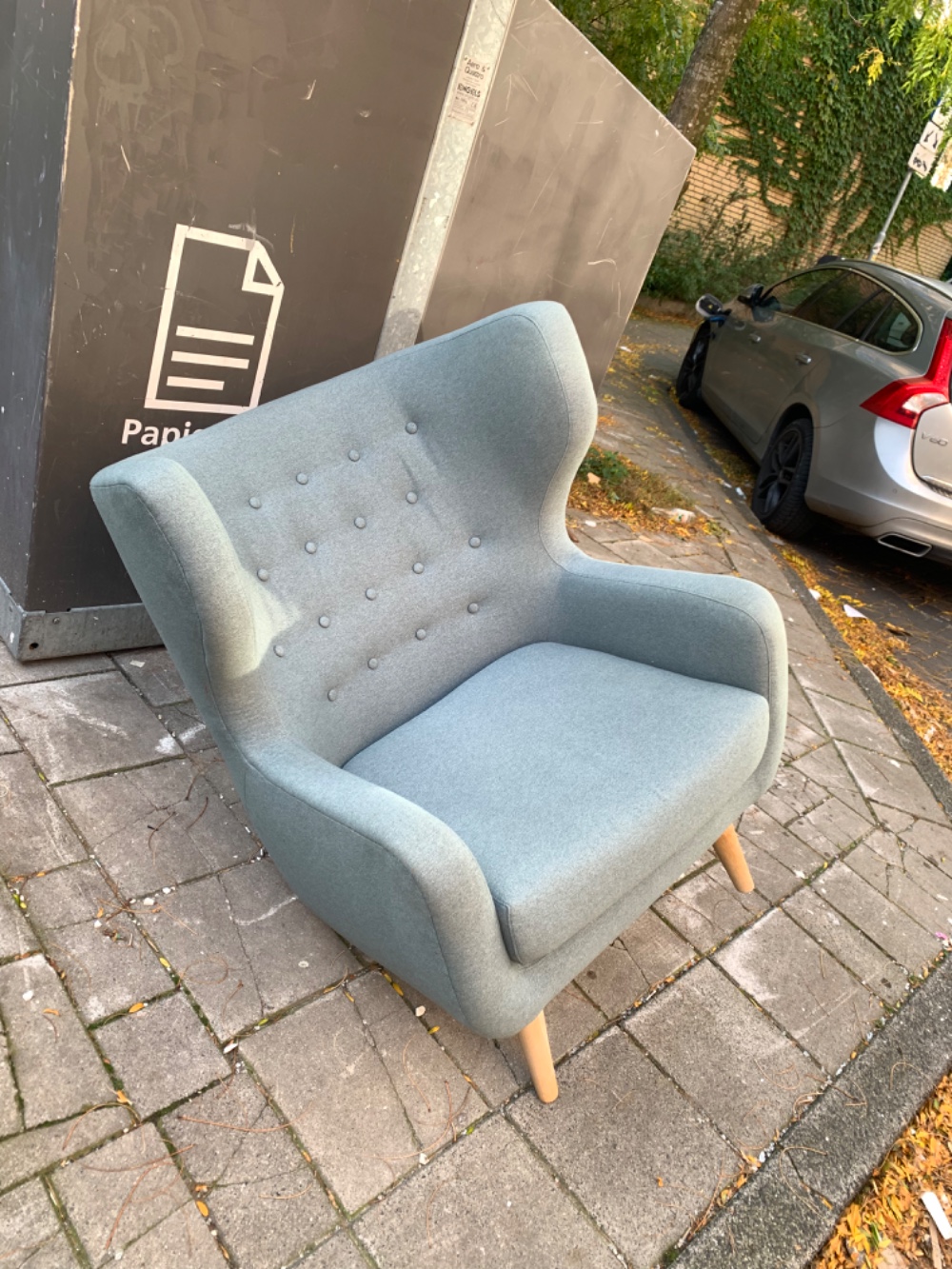 Armchair with one leg missing