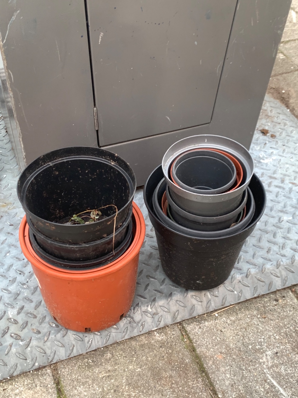 A bunch of plastic plant pots