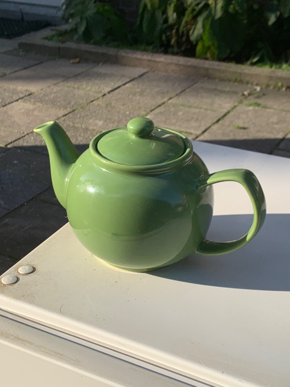 A nice green teapot and some plates photo 2