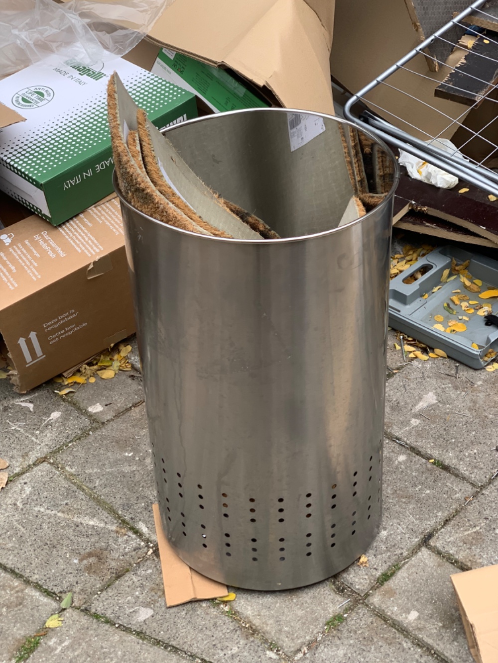 Nice large metal bin and some door rugs inside