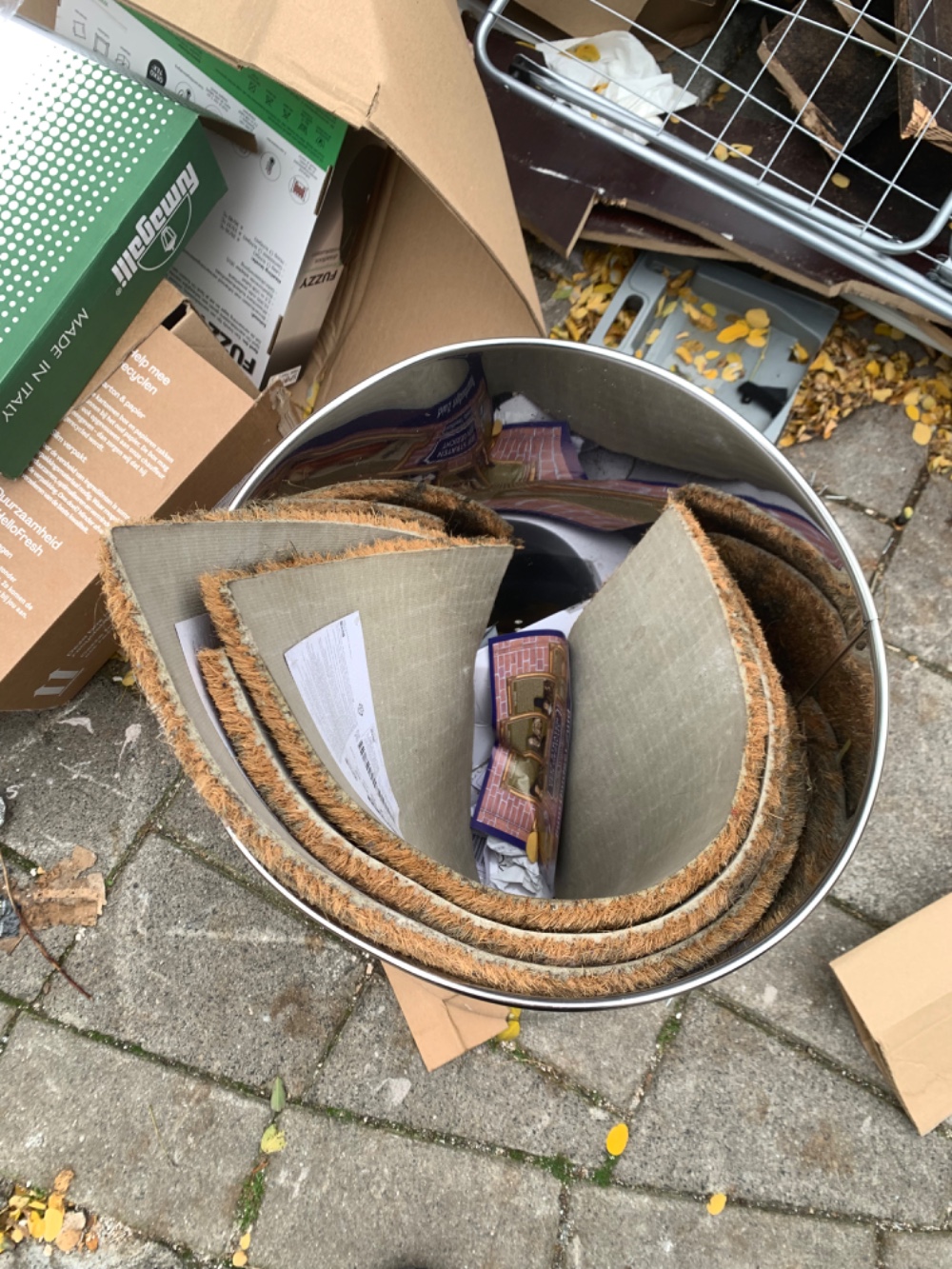 Nice large metal bin and some door rugs inside photo 2