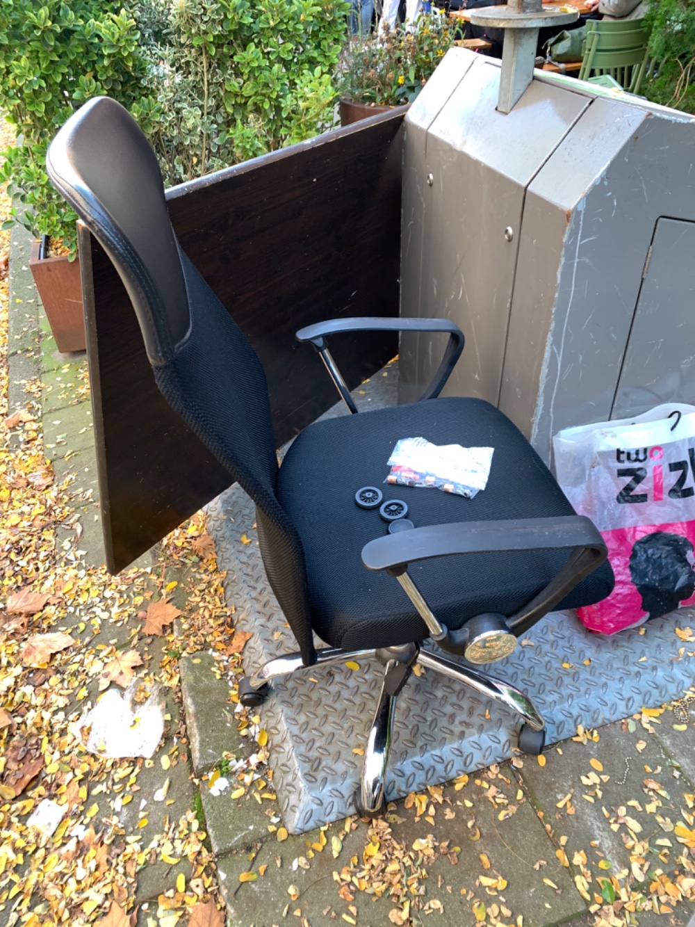 Office chair with one broken wheel and a huge table top