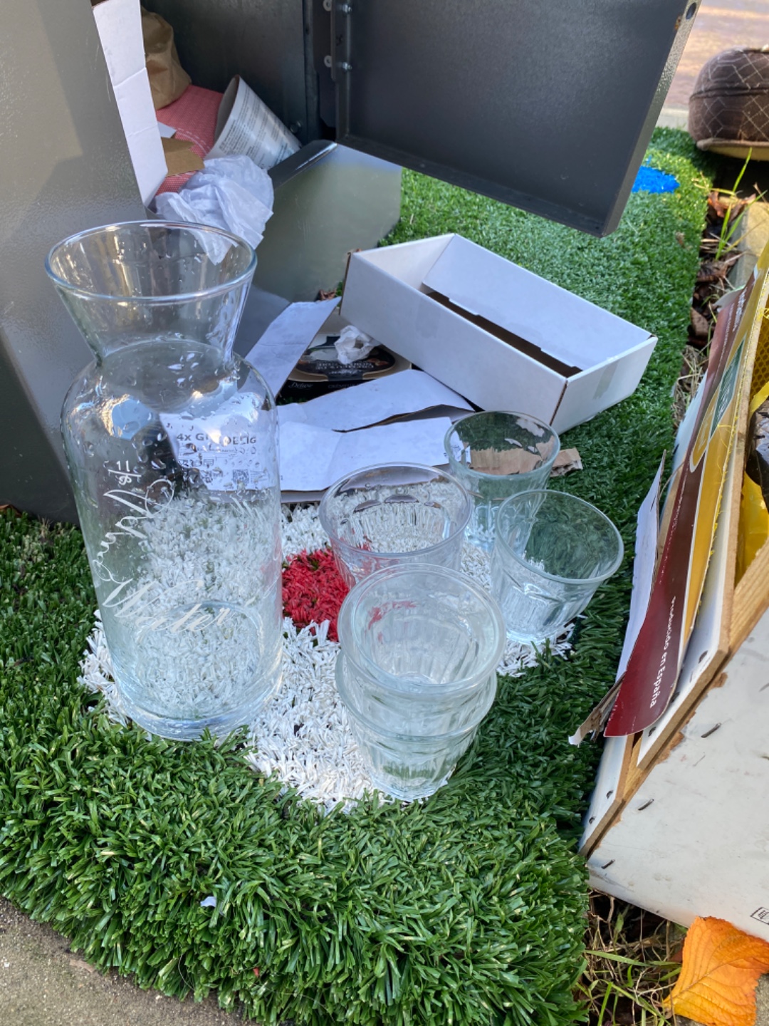 Many tea and water glasses, a jar and a jug