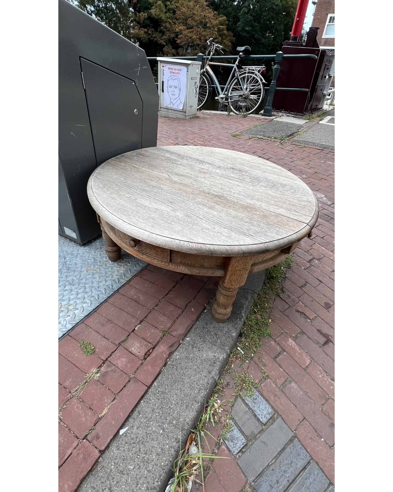 The round table is proper wood. Solid and heavy. Just needs some sanding and oiling. photo 3