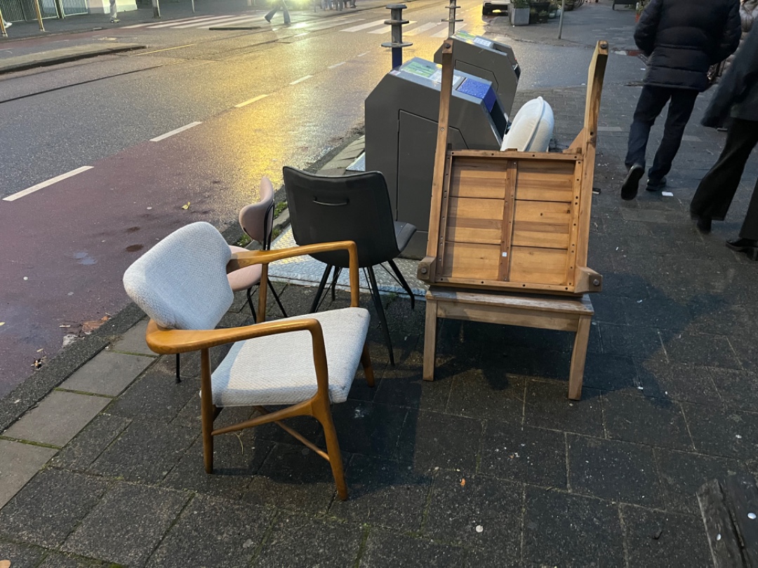 Right in front of artis, beautiful chairs and couch