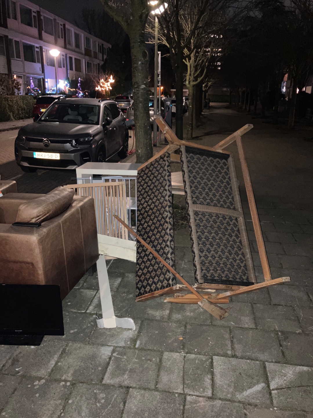 Two leather chairs, colorful carpet, wooden bench, small white cabinet, dish drying rack, scren photo 2