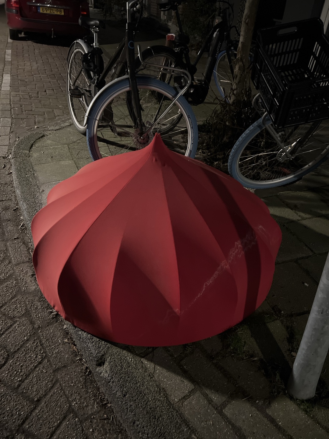 Enormous red lampshade from red fabric, inside had silver lining.  Grensstraat 31, oost photo 1