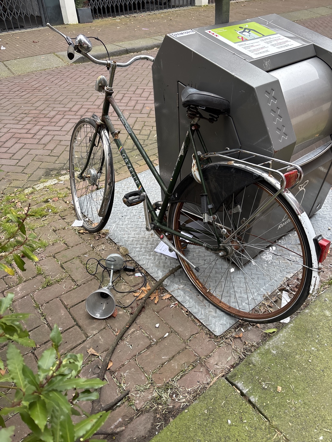 Gazelle bike, a bit beaten up and locked, but free photo 1