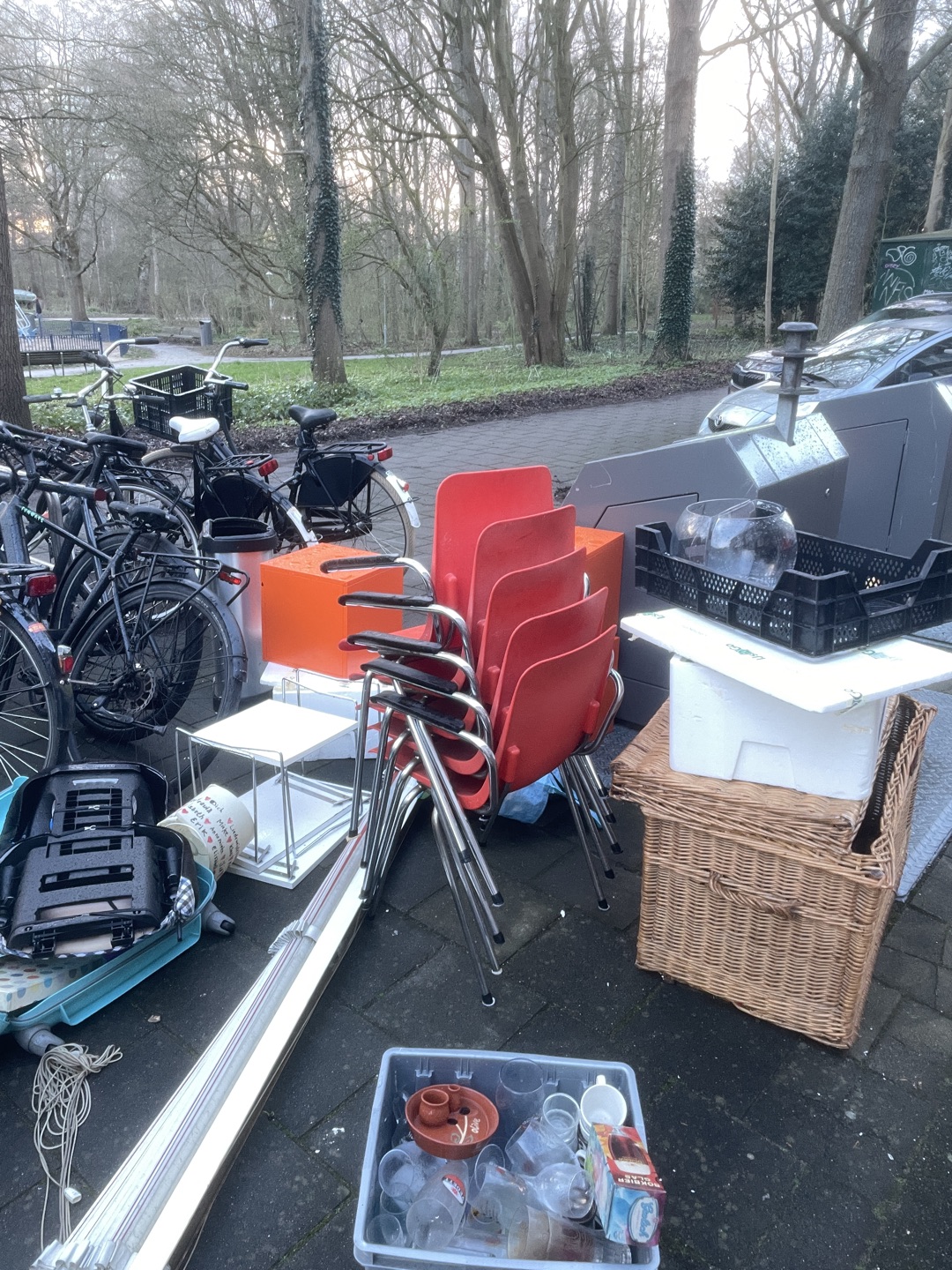 Red chairs and orange storage cabinets and big basket