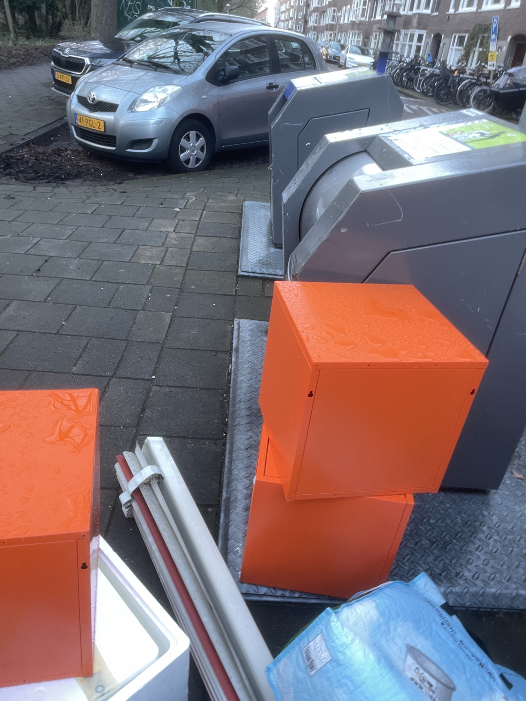 Red chairs and orange storage cabinets and big basket