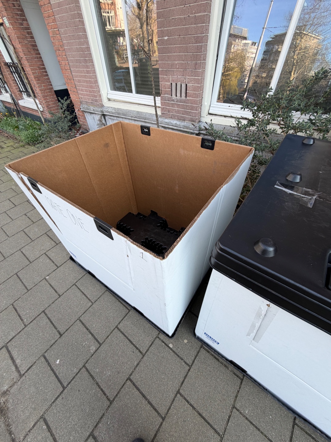 Reusable pallets with tops. Used once for air freight.