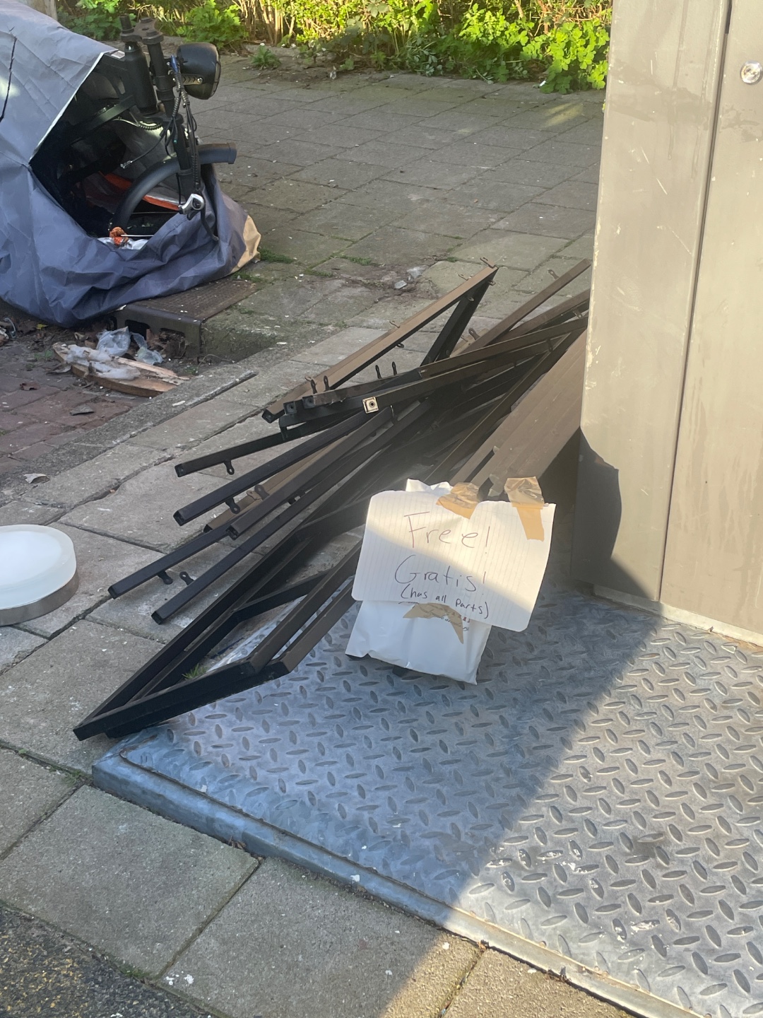 Black metal shelving unit available for free! First photo is what it looks like assembled. All parts are there.