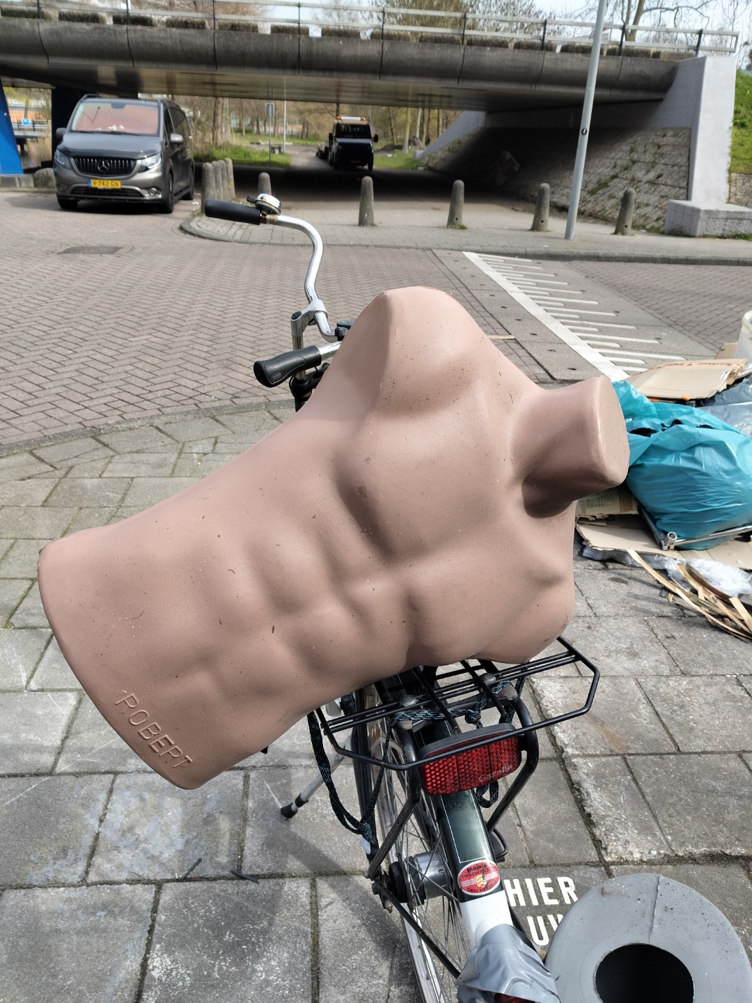 Multiple mannequin torsos, child mannequin legs, some ceramic unbroken dishes, a styrofoam mannequin standee