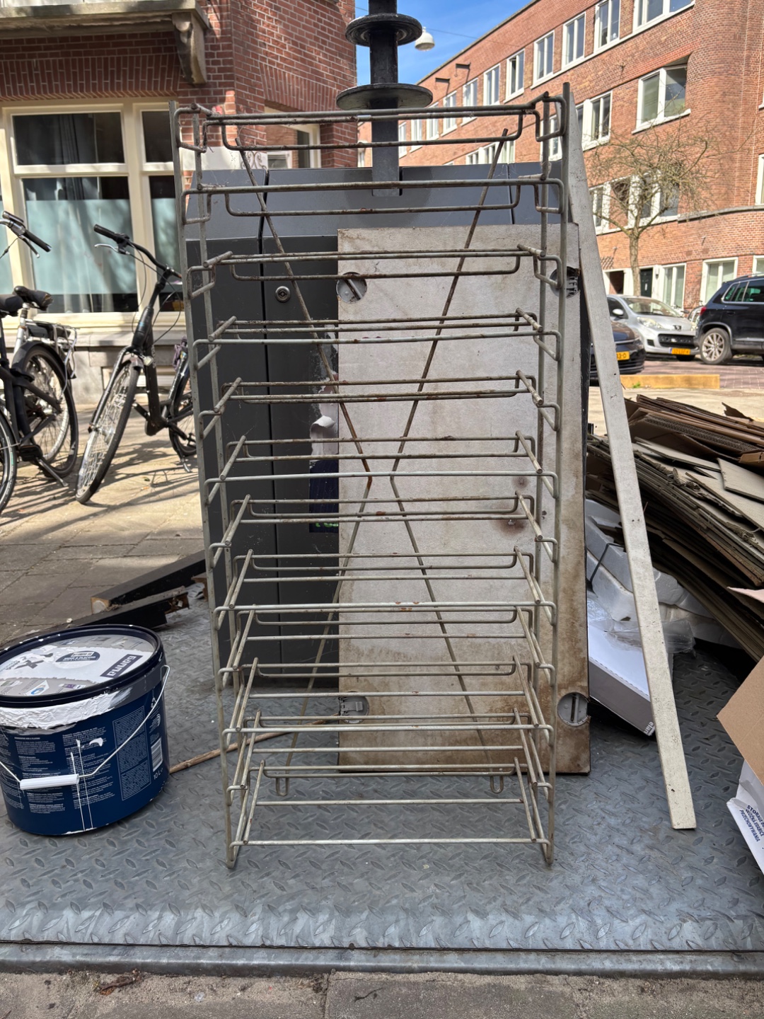 Shoe rack? Definitely old, indestructable/ solid steel. Needs refinishing. 3
