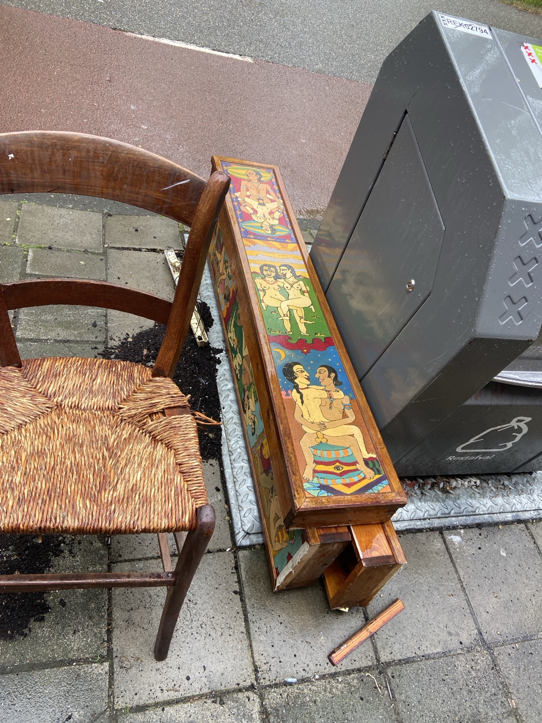 Wooden chair, and interesting (kamasutra?) light boxes. 1