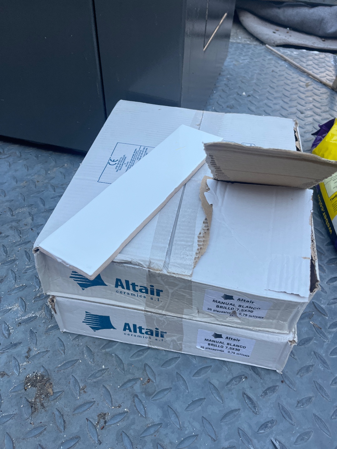 Two boxes with 35 white tiles 1
