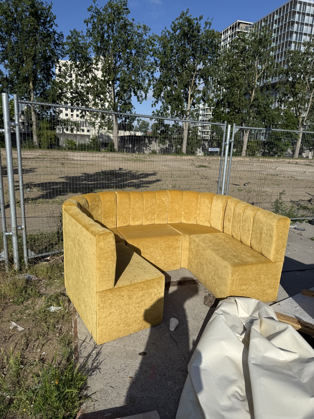 Yellow velvet couch (wet from rain) 1