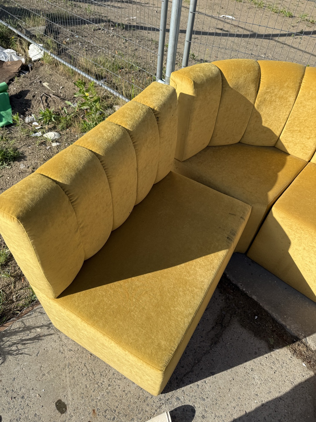 Yellow velvet couch (wet from rain) 2