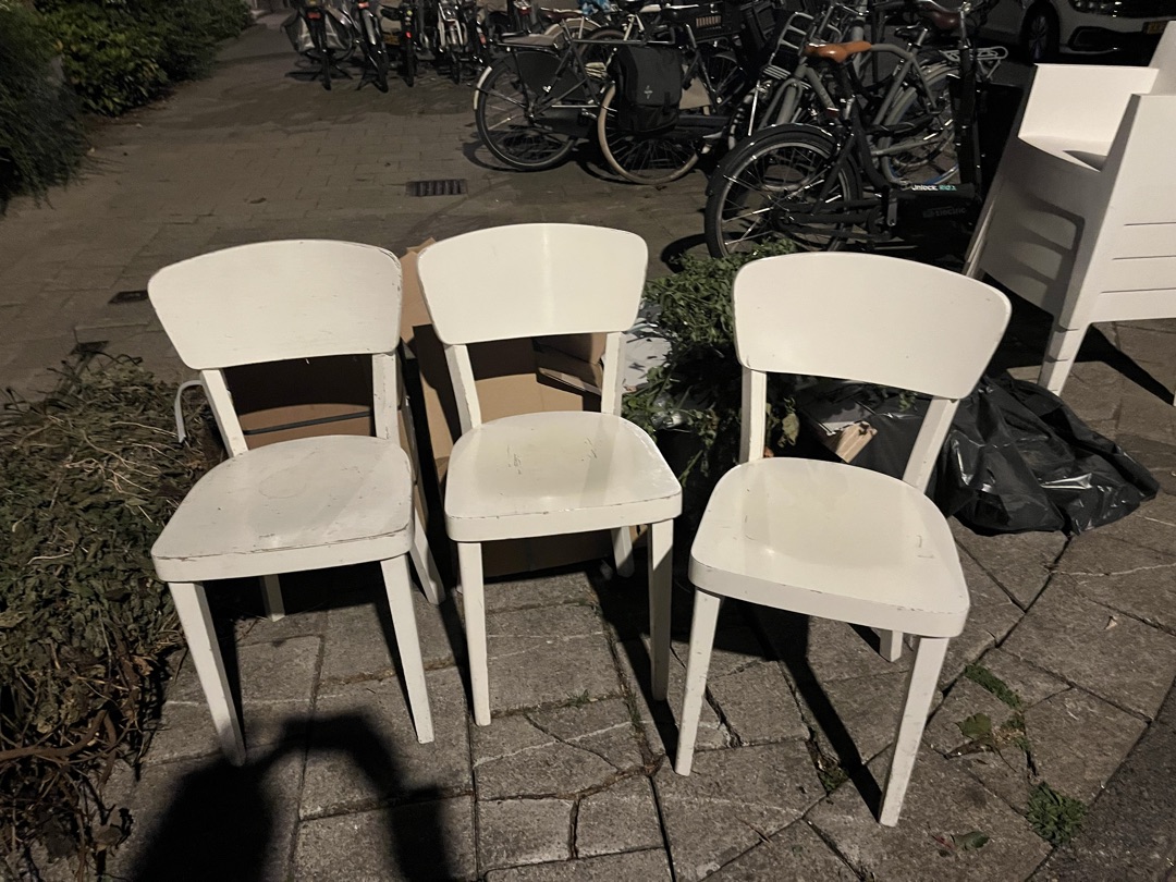 Three indoor wooden chairs and four outdoor plastic chairs, all good condition 2